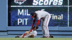 Bryce Harper Collides With Wall, Jams Shoulder & Cuts Chin
