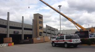 One Dead, One Rescued in Garage Collapse