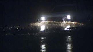 Car Drives Through High Water