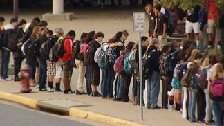 Classmates Hold Hands as They Mourn Herndon Family