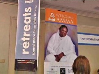 Thousands Line Up to Meet Hugging Saint