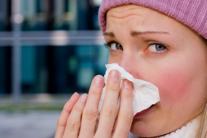 Woman sneezing Woman sneezing