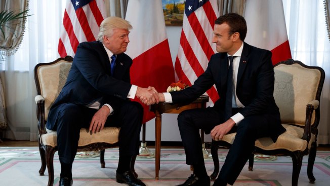 Emmanuel Macron swerves past Donald Trump to embrace Angela Merkel