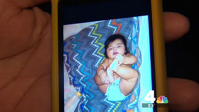 The father of a baby girl is grieving after her death. Police say the 7-month-old was killed by her 14-year-old brother.