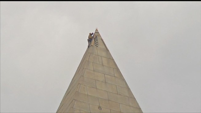 Crews began setup today to seal cracks in the Washington Monument caused by the August earthquake. The weatherization process will stop water from getting into the landmark when it rains, according to the National Park Service.