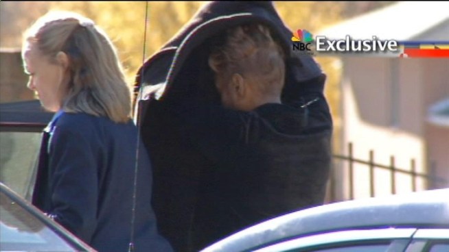 Listen to a phone call that prosecutors say is between Leslie Johnson and Jack Johnson as FBI agents arrive at their home.
