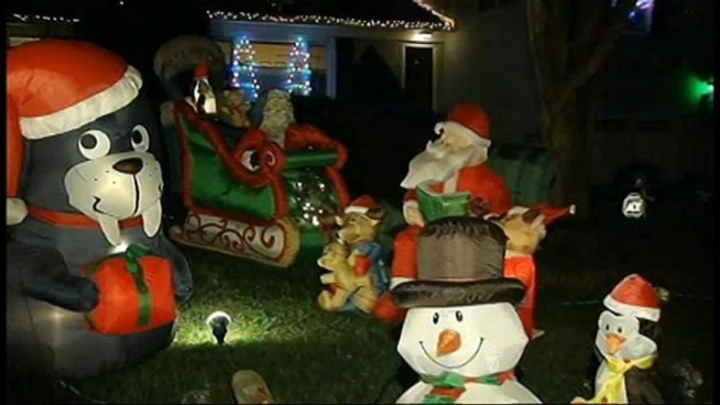 The Elliott family decorates its Bethesda, Md., lawn with 83 inflatable decorations.