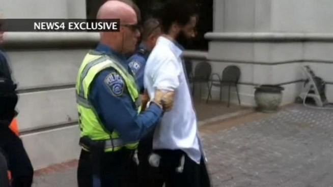 Exclusive video of a man in custody after a Molotov cocktail was thrown inside the Ballston Common Mall.