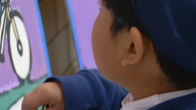 Volunteers painted a mural to beautify a Prince George's school.