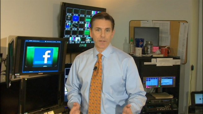 Jim Rosenfield with an officer's story after he tried to save a man from a burning car in Prince George's County.