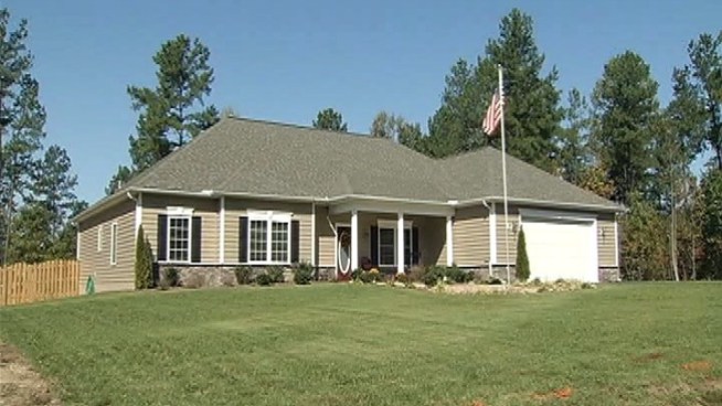 A wounded warrior and his wife say they have their lives back after a local charity and group of home builders make over their <a title=