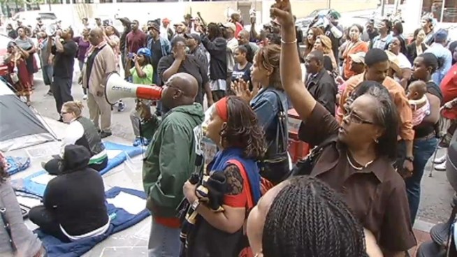Protesters armed with bullhorns and cake stage a noisy and messy protest outside Pepco. Erika Gonzalez reports.
