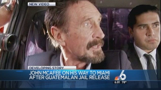 Internet entrepreneur John McAfee was escorted by Guatemalan immigration officials to the Guatemala City airport before he flew to Miami on Wednesday. Journalists crowded around the vehicle of McAfee, who Belizean officials say is wanted for questioning in the slaying of an American expatriate.