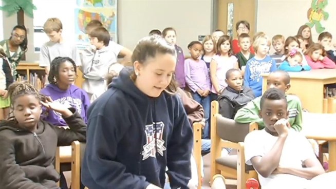 Dozens of kids in Fairfax County got to pay tribute on this Veterans Day in a very special way, and as Northern Virginia Bureau Chief Julie Carey shows us, thanks to technology, two students also got to spend part of the day with their dad, who is serving in Afghanistan.