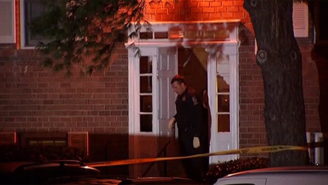 Two men were inside an apartment when several others entered and killed the victim, a survivor told authorities.