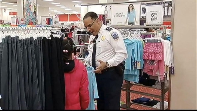 DC Police took some time this morning to shop for holiday gifts with local children at a Target store in Columbia Heights.