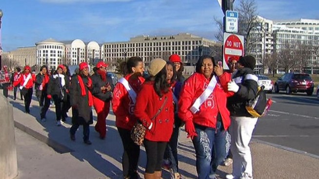 Thousands walked along the national mall today to mark the 100th anniversary of a march to help women get the right to vote. 