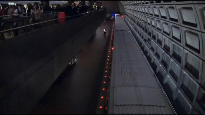 Metro investigators spent Wednesday trying to figure out why a train went partially off the tracks inside the Rosslyn station Tuesday.