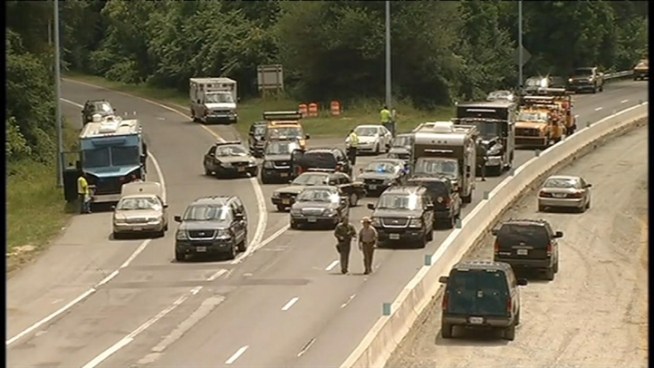 Police search for an armed man along the Baltimore-Washington Parkway in Maryland.