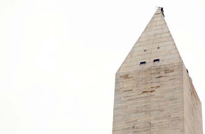Rigging was secured Tuesday for a rappelling mission to identify earthquake damage to the Washington Monument.