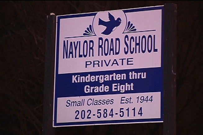Darcy Spencer talks to parents at Naylor Road School after an employee is attacked.