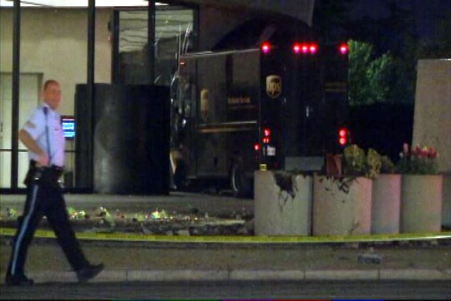 A UPS truck crashes into the side of the <a title=