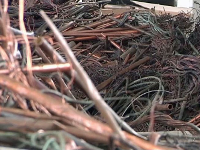Police say two men stole metal while on the job almost every day for four years.