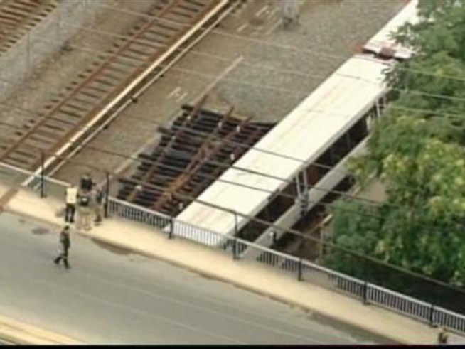 Chopper4 video of power lines across railroad tracks.