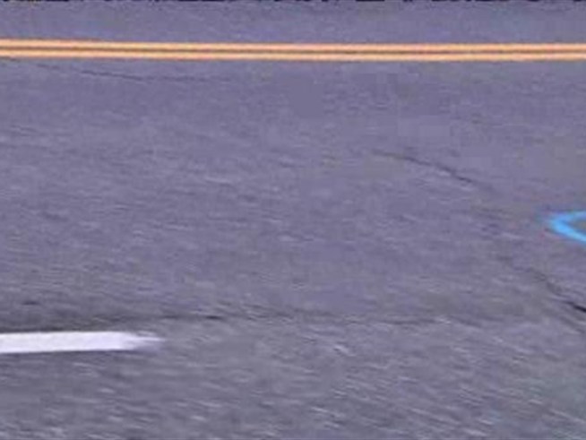 A 16-year-old girl was hit and killed trying to cross a dark and busy <a title=