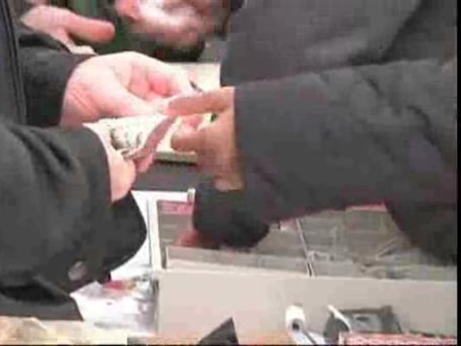 People stood out in the cold and rain on Capitol Hill Thursday to get pennies.