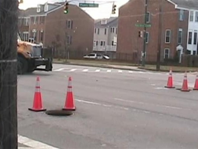 A manhole cover flew through the windshield of a car after an apparent explosion.