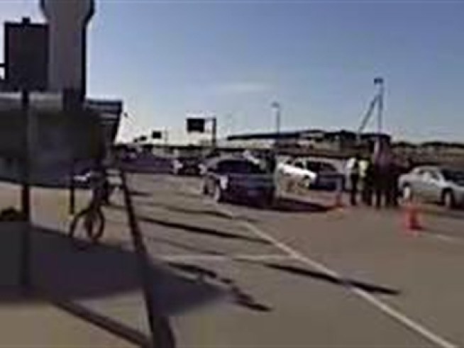 View raw video from the scene of a crash after a car chase through the city.