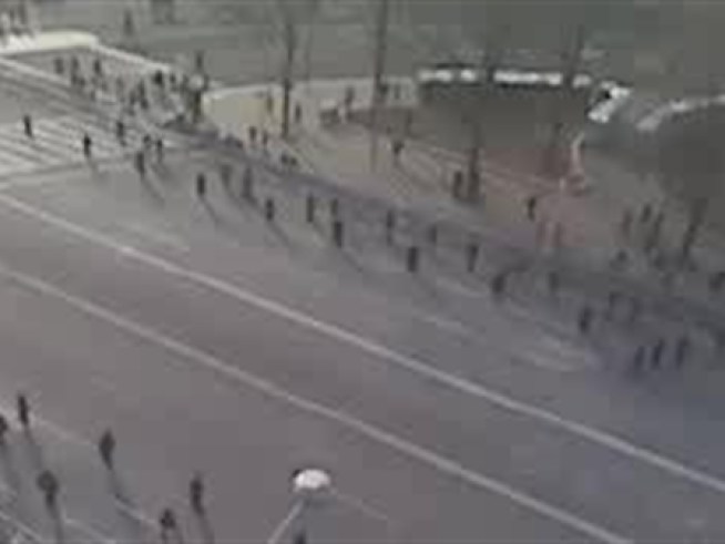 Security personnel line both sides of the Pennsylvania Avenue parade route.