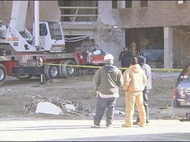 Backhoe Operator Killed in 8-Story Plunge