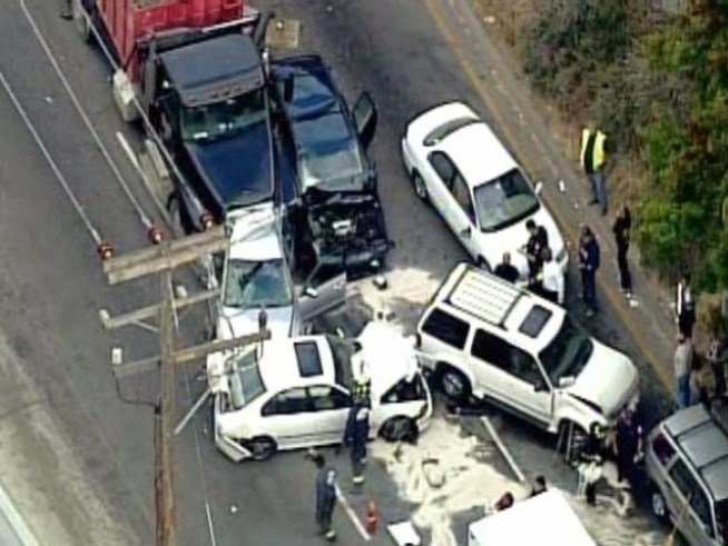 Two people died and 20 more were injured when 50 vehicles crashed in foggy condition on Interstate 77 near <a title=