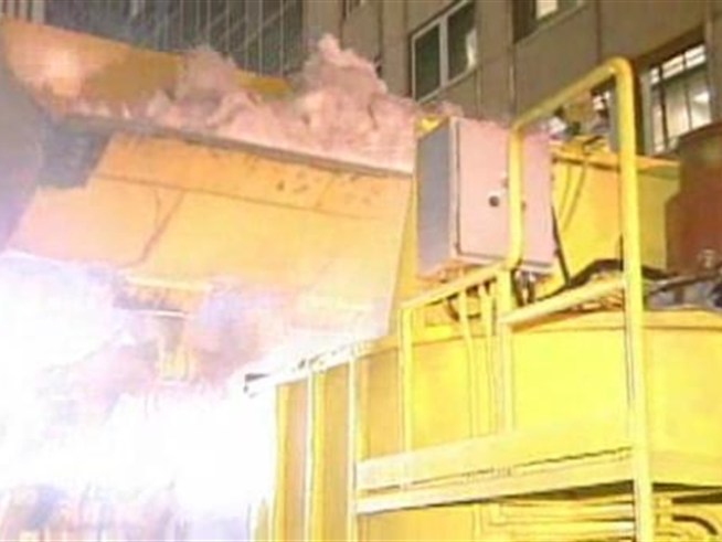 Video of snow melter removing mounds of snow following 2003 snow storm.