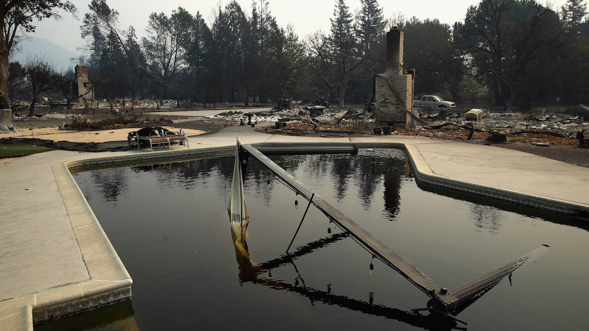 Couple Took Refuge in Pool as Wildfire Burned Home: Report