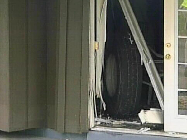 102908 Dump Truck Tire Through Window