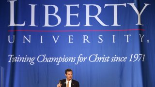 Jerry Falwell Jr., president and chancellor of Liberty University, introduces the convocation speaker in the Vines Center at Liberty University in Lynchburg, Va., Feb. 13, 2013.