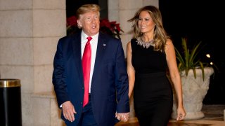 President Donald Trump and first lady Melania Trump arrive for Christmas Eve dinner at Mar-a-lago in Palm Beach, Fla., Tuesday, Dec. 24, 2019.