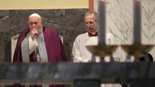 Pope Francis coughs inside the Basilica of Saint Anselmo