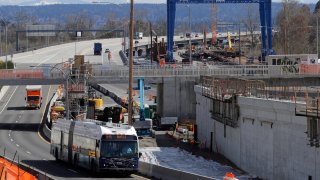 a bus drives past a roadwork construction project in Seattle