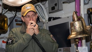In this image provided by the U.S. Navy, Capt. Brett Crozier, then-commanding officer of the aircraft carrier USS Theodore Roosevelt (CVN 71), addresses the crew on Jan. 17, 2020, in San Diego.