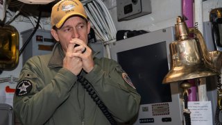 In this image provided by the U.S. Navy, Capt. Brett Crozier, then-commanding officer of the aircraft carrier USS Theodore Roosevelt (CVN 71), addresses the crew on Jan. 17, 2020, in San Diego.