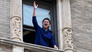 Brian Stokes Mitchell sings from his window