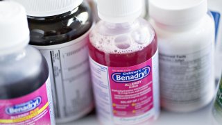 In this April 14, 2016, file photo, a bottle of Johnson & Johnson Benadryl brand allergy medication is arranged for a photograph in Tiskilwa, Illinois.