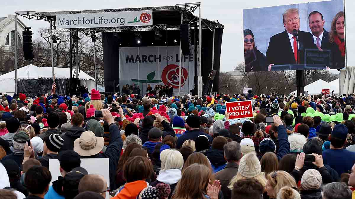 Pro-life demonstrators listen to US President Donald Trump as he speaks at the 47th annual “March for Life” in Washington, DC, on January 24, 2020. – Trump is the first US president to address in person the country’s biggest annual gathering of anti-abortion campaigners. (Photo by OLIVIER DOULIERY / AFP) (Photo by OLIVIER DOULIERY/AFP via Getty Images)