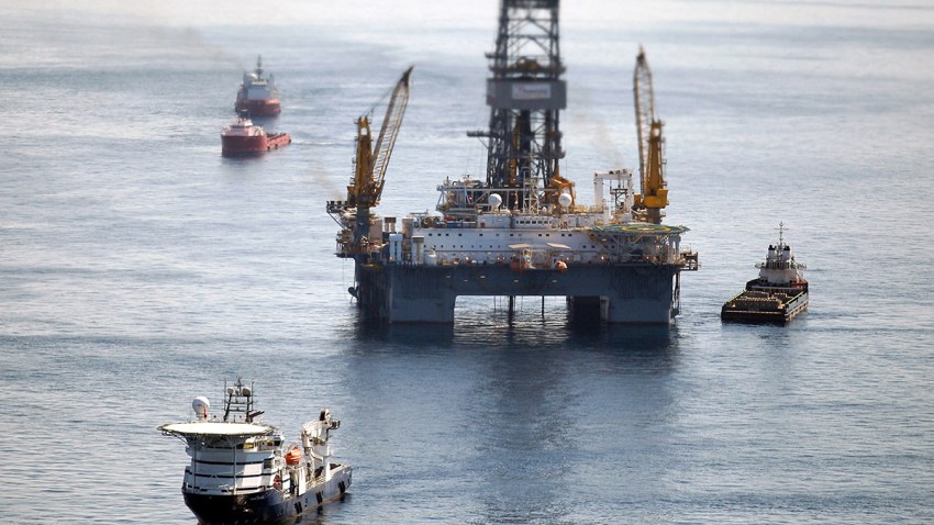 Ships work near the site of the BP Deepwater Horizon oil spill on Aug. 3, 2010, in the Gulf of Mexico off the coast of Louisiana.