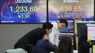 In this April 27, 2020, file photo, currency traders watch monitors at the foreign exchange dealing room of the KEB Hana Bank headquarters in Seoul, South Korea.