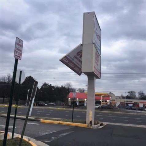 Powerful winds cause large Potomac Mills sign to lean
